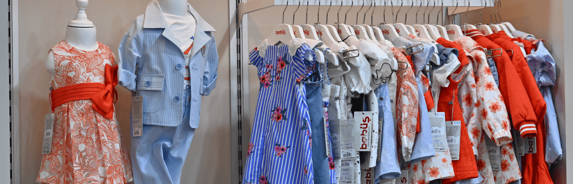 Three showcased fancy evening dresses at the CBME Türkiye exhibition.